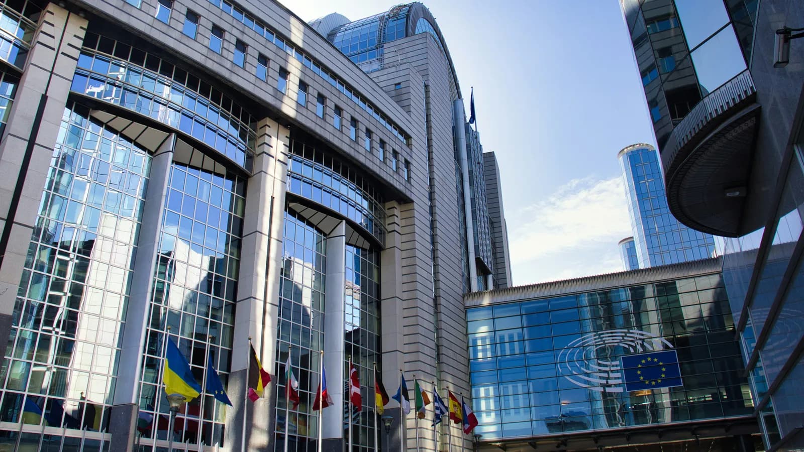 European Parliament building with EU flags, representing EU institutional interpreting