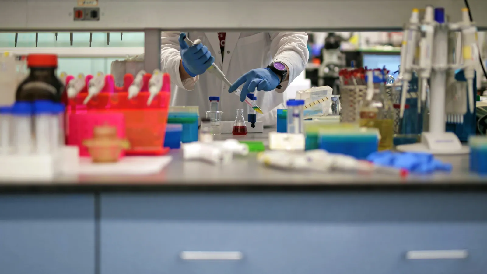 Scientist working in a laboratory, representing life-sciences interpreting