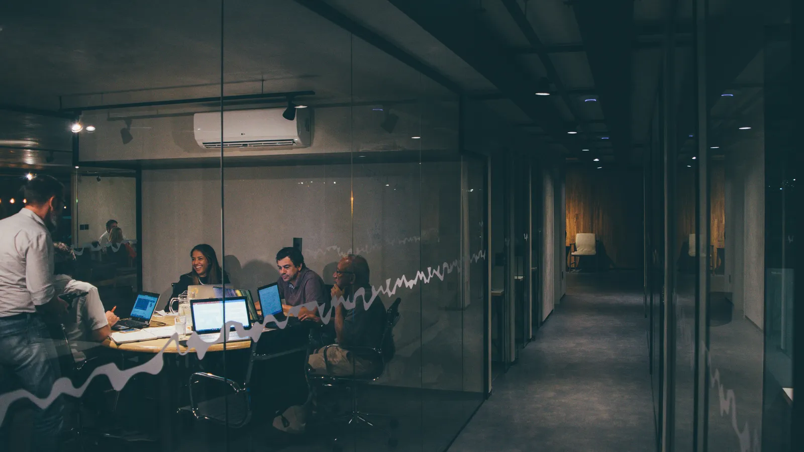 Group meeting in an office, representing tech-sector interpreting