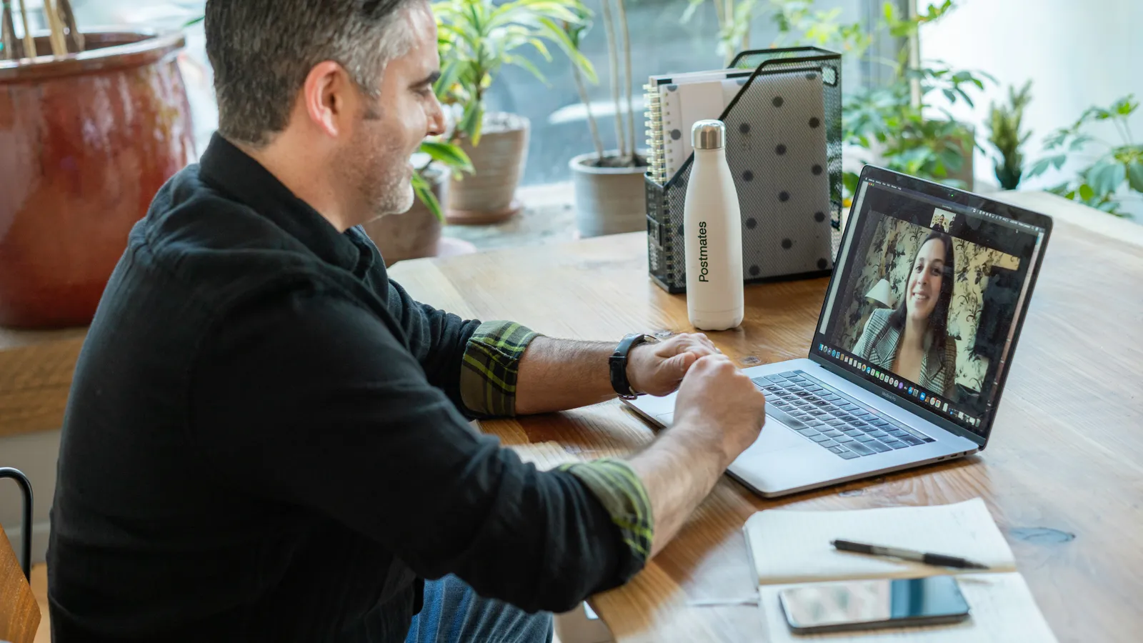 Professional on a virtual call in an office, representing hybrid interpreting delivery