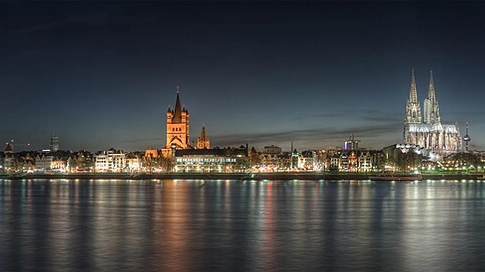 Cologne Cathedral and Groß St. Martin across the Rhine at night