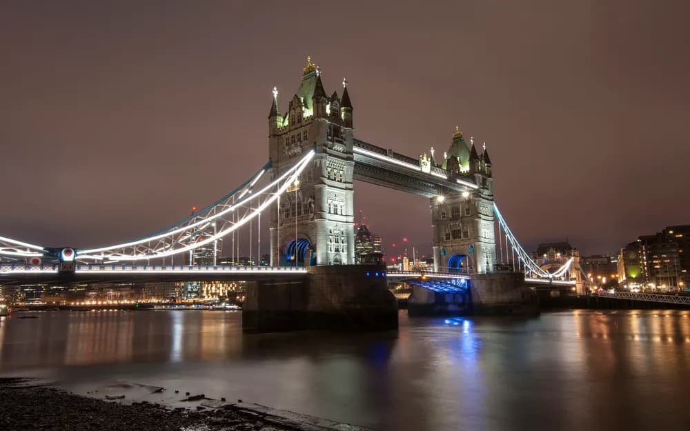 Tower Bridge lit up at night over the River Thames, London