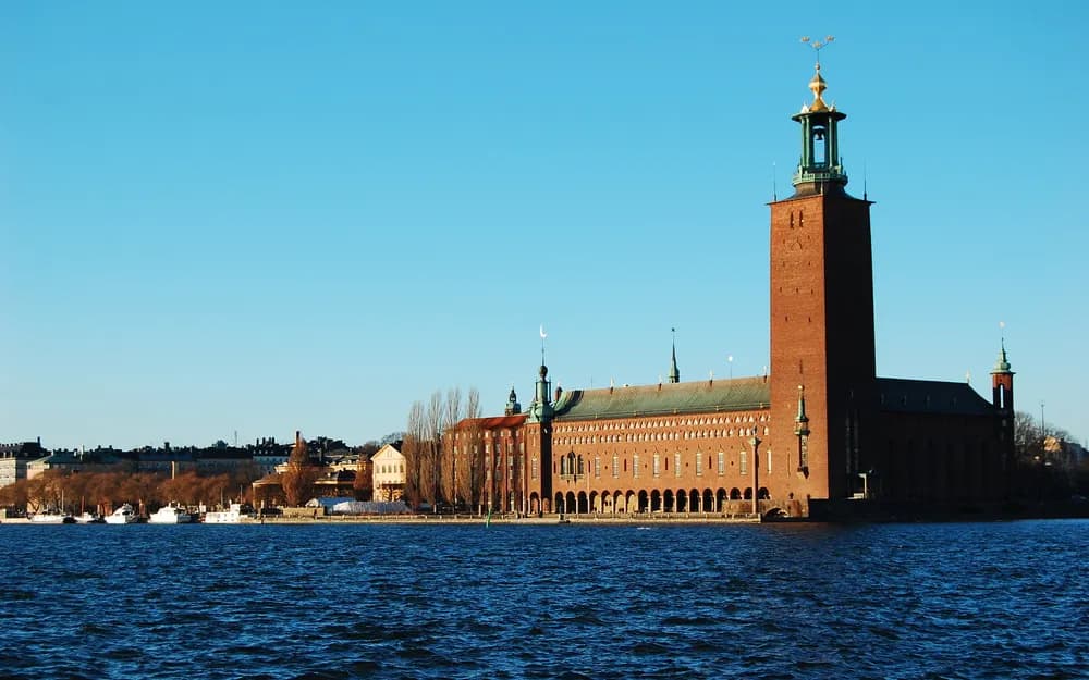 Stockholm City Hall across the water at sunset