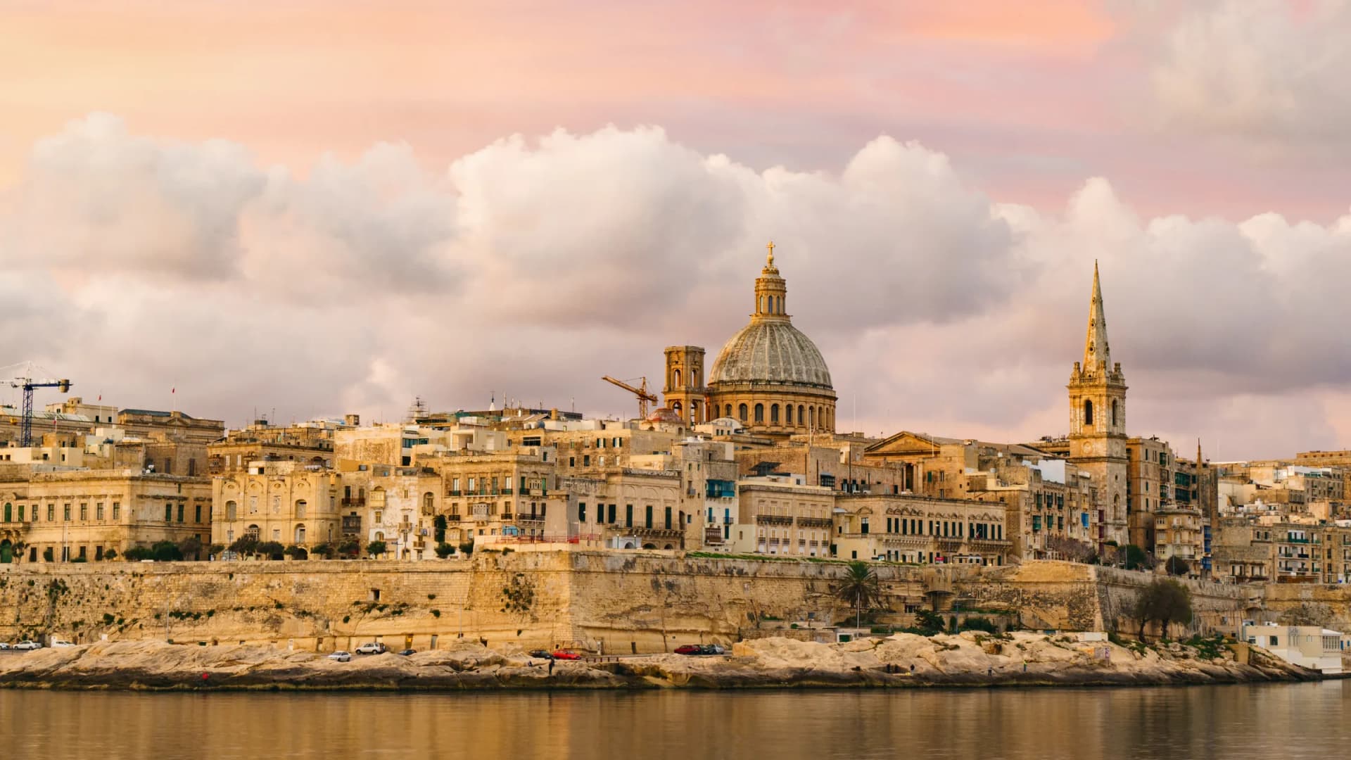 Panorama of Valletta's fortified harbor and Baroque skyline