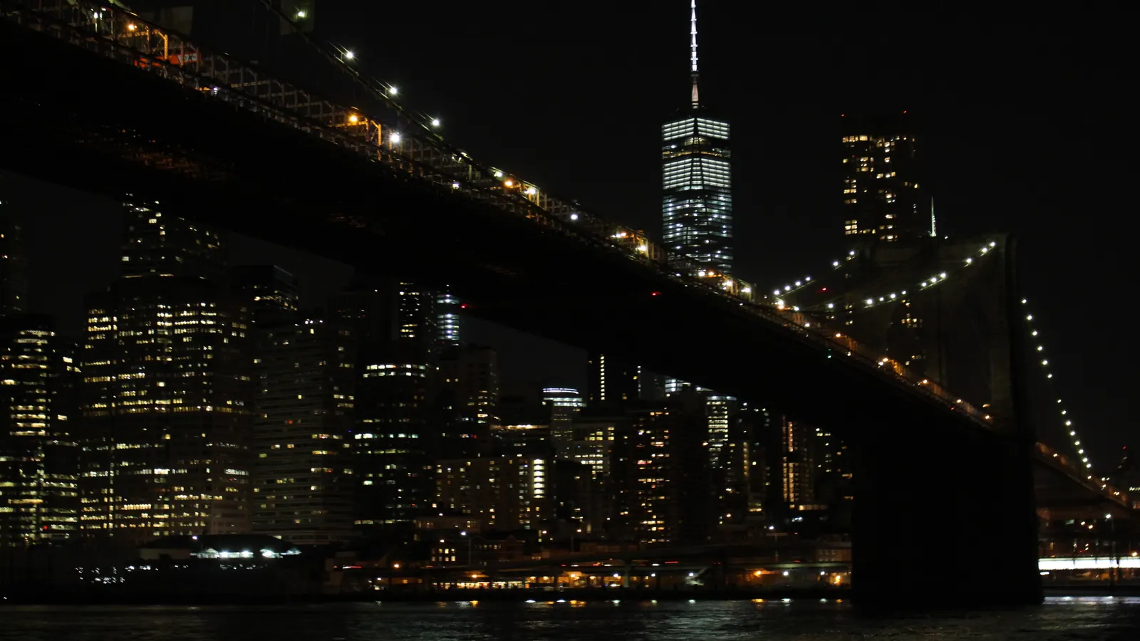 Brooklyn Bridge at night with the Manhattan skyline