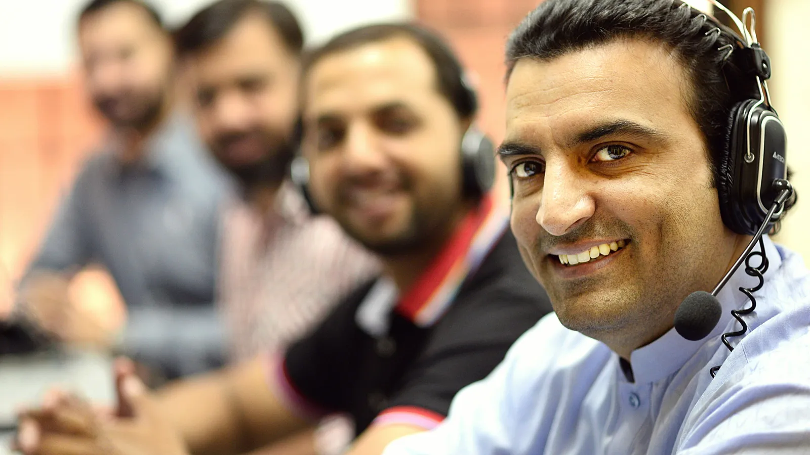 Call center team at work, representing public-service telephone interpreting