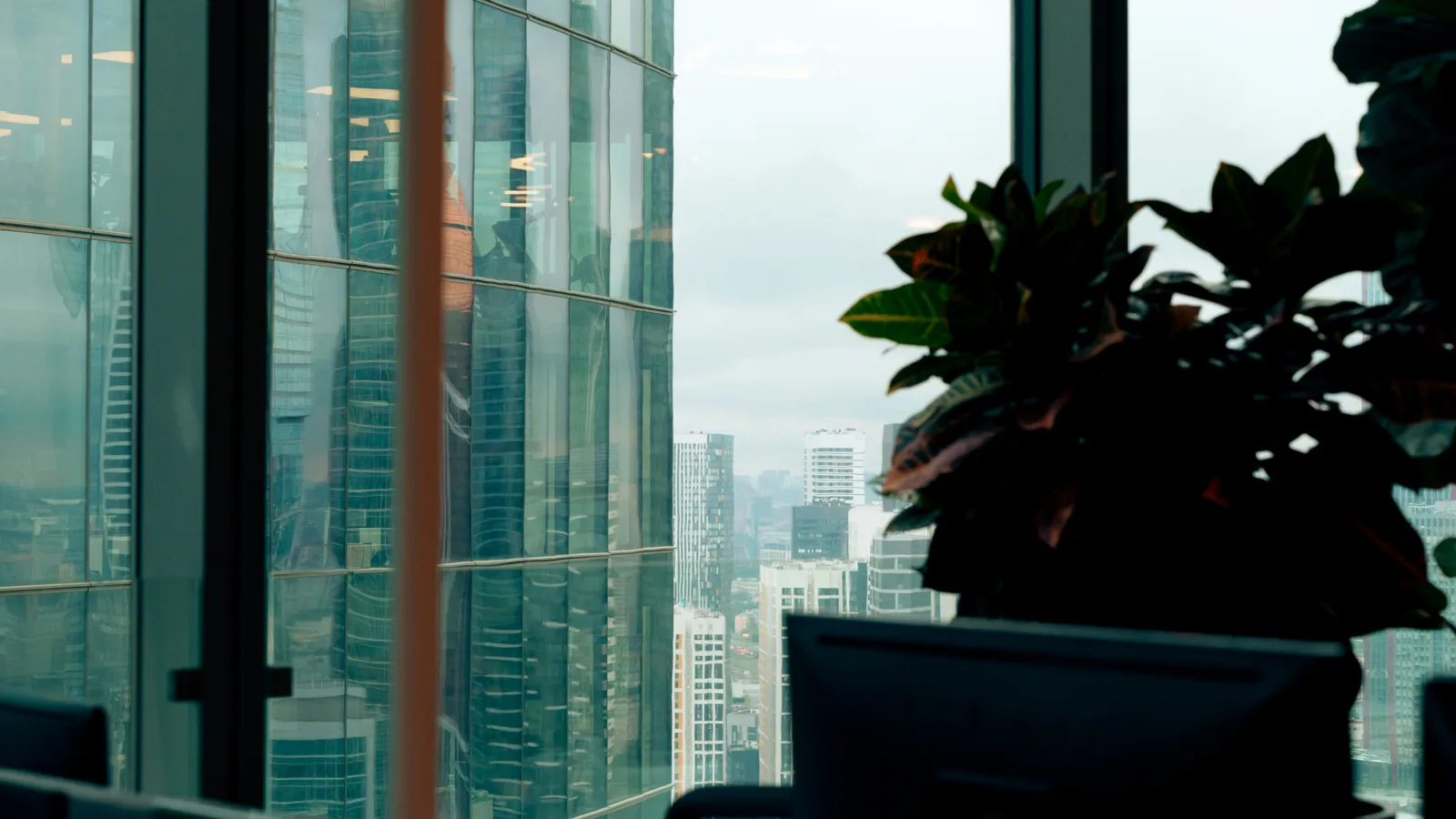 Modern office overlooking a city skyline, representing financial-sector interpreting