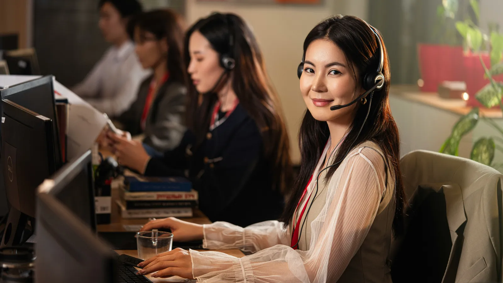 Colleagues working together in an office, representing alternating whispered interpreters
