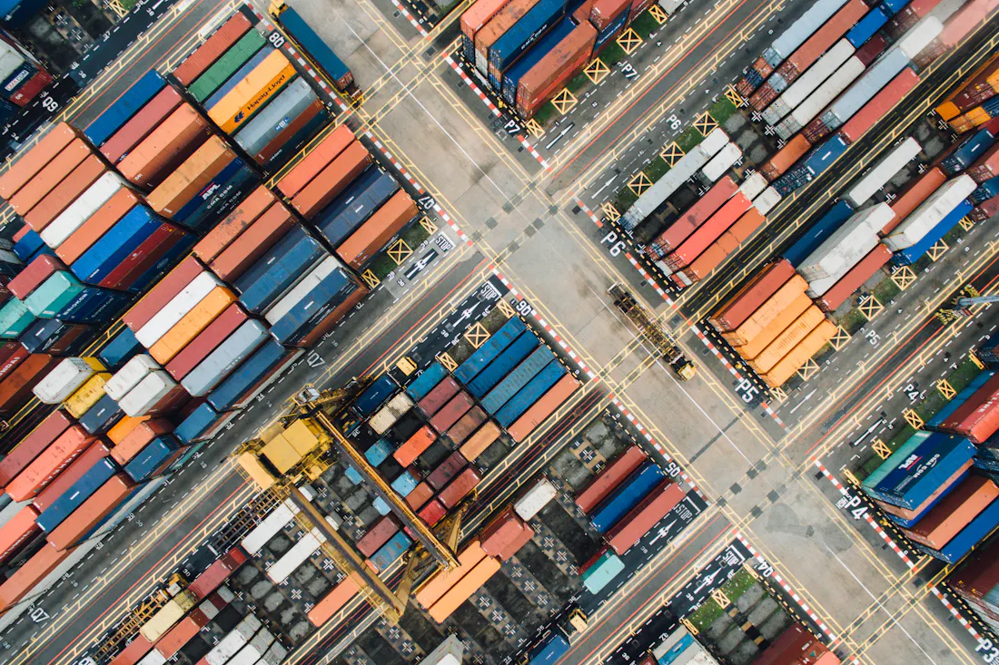 Aerial view of a container terminal with stacked shipping containers