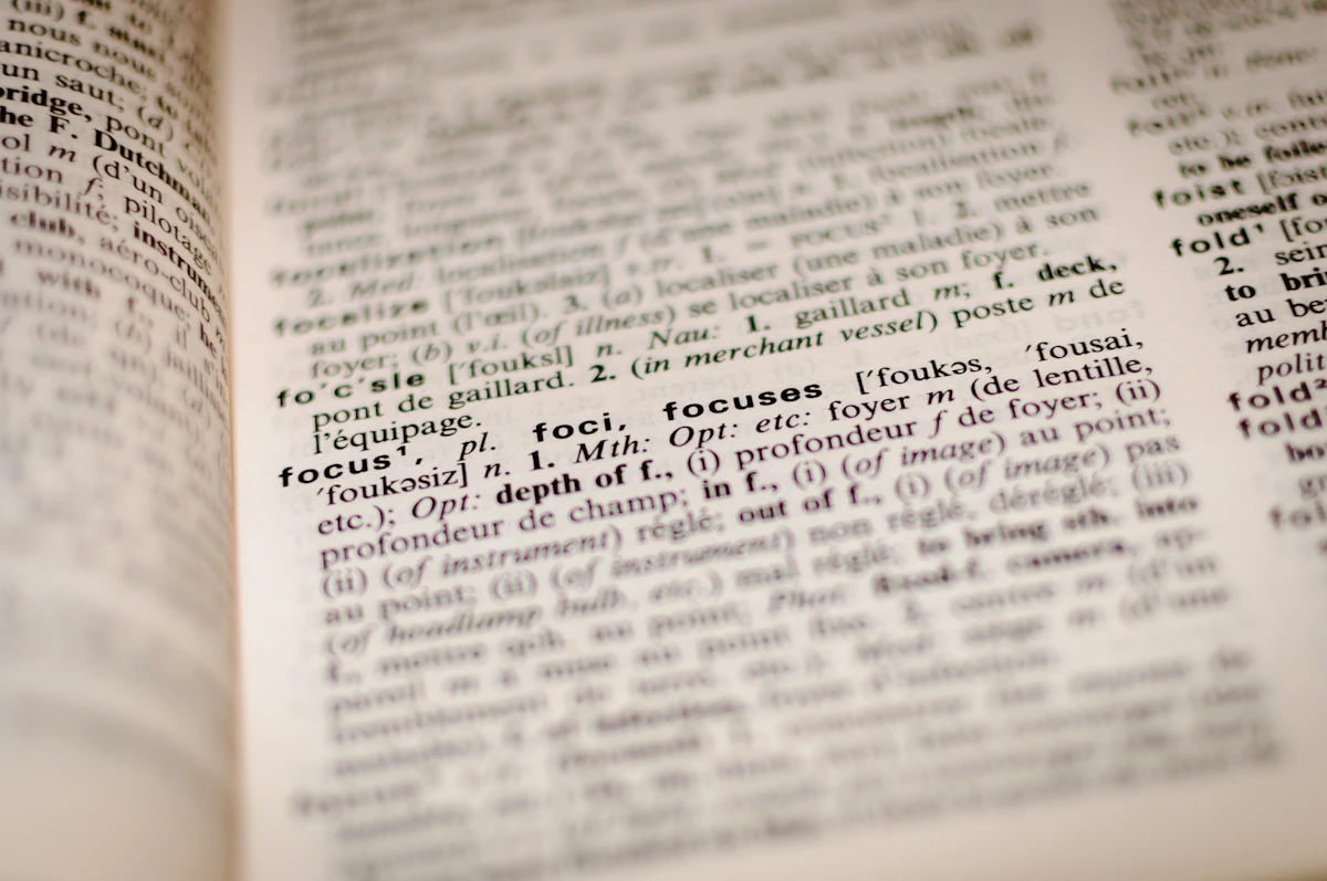 A bilingual English to French dictionary open at a page of entries